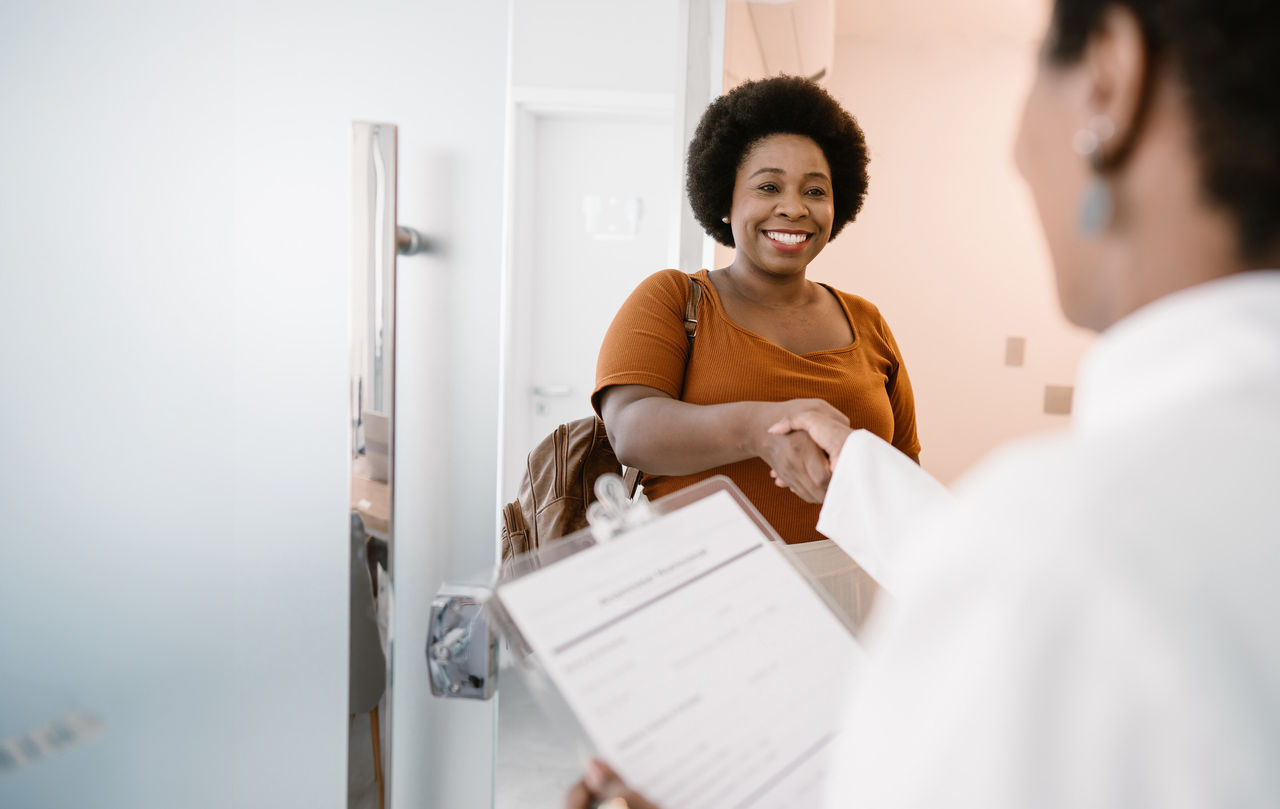 Woman shaking a doctor's hand