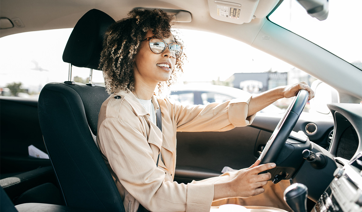 Young woman driving a car