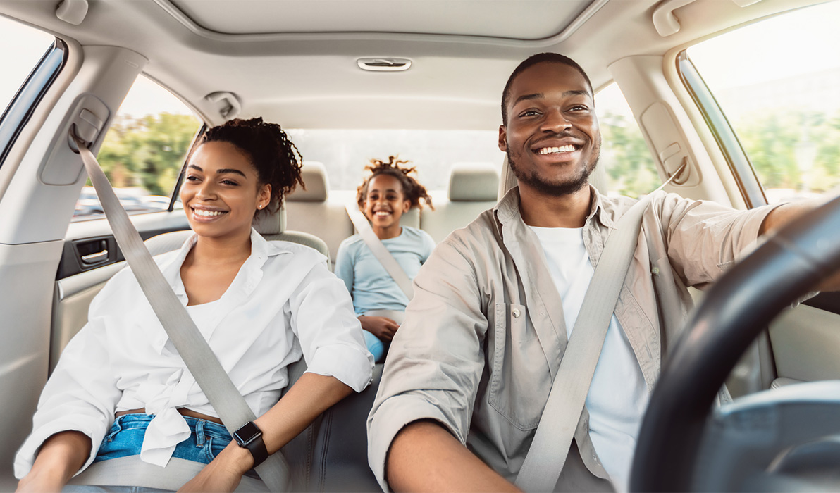 Happy family in a car the father is driving