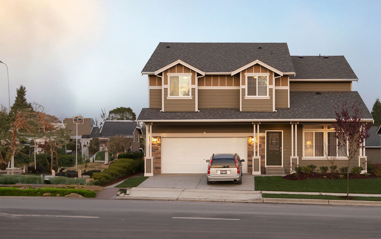 House with an SUV in the driveway